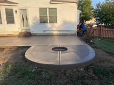 concrete-patio Ways To Extend Concrete Patio, Cement Decks Patio, Outdoor Patio Ideas Concrete, Circular Concrete Patio, Small Back Patio Ideas Concrete, Backyard Concrete Slab Ideas, Concrete Back Patio Ideas, Round Cement Patio Ideas, Patio Extension Ideas Concrete