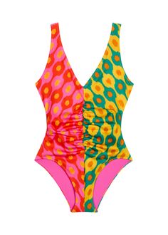 Featuring a plunging neckline and back but plenty of coverage, the fully-lined Coco one-piece is a head-turner, thanks to the mixed prints and figure-flattering shirring at the front and back. Pack it for your next trip to Ibiza. Multicolor Ruched Swimwear For Poolside, Fitted Multicolor Print Swimwear For Summer, Multicolor Ruched Swimwear For Pool, Chic Multicolor Stretch Swimwear, Chic Stretch Multicolor Swimwear, Multicolor Ruched Swimwear For Beach Season, Retro Color Block Swimwear For Summer, Chic Multicolor Triangle Top Swimwear, Multicolor Color Block Swimwear For Party