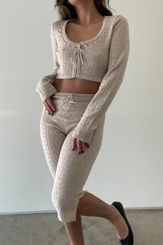 l Knitted Pointelle Front Tie Top and Capri Pants Sets    l 44% Viscose, 37% Nylon, 19% Polyester    * MODEL IS 5'3″ AND IS WEARING A SMALL Capri Set, Peplum Sweater, Fleece Shorts, Bralette Tops, Front Tie Top, Tie Top, Sweater Set, Knit Set, Straight Leg Pants