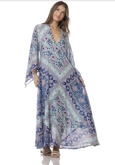 Indulge in the ethereal beauty of our Audrey Maxi Dress with Butterfly Sleeves in Blue. This stunning piece is crafted from 100% Indian cotton, making it soft and comfortable against your skin. The intricate butterfly sleeves add a touch of whimsy and romance, making you feel like a true goddess. The dress features a beautiful blue print that will transport you to a dreamy paradise. The flowy maxi length adds a touch of elegance and grace to your every step. Whether you're strolling along the be Blue Breezy Flowy Cover-up, Blue Flowy Breezy Cover-up, Spring Flowy Dresses With Kimono Sleeves, Spring Dresses With Flowy Fit And Kimono Sleeves, Spring Dresses With Flowy Kimono Sleeves, Flowy Spring Dresses With Kimono Sleeves, Spring Dresses With Kimono Sleeves, Blue Bohemian Maxi Dress With Boho Print, Blue Wrap Maxi Dress For Spring