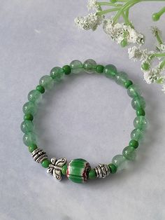 Excited to share the latest addition to my #etsy shop: Personalized charm bracelet, Green strawberry quartz bracelet，Dainty butterfly beaded bracelet,African trade beads bracelet, Gift for Mom https://etsy.me/3Koei8a #green #silver #no #unisexadults #yes #round #crysta Bohemian Green Crystal Bracelet With Round Beads, Casual Green Gemstone Bead Jewelry, Casual Green Gemstone Beads Jewelry, Bohemian Green Crystal Round Bead Bracelet, Green Round Bohemian Crystal Bracelet, Adjustable Green Crystal Bracelet With 8mm Beads, Adjustable Green Crystal Bracelet With Round Beads, Green Adjustable Crystal Bracelet With Round Beads, Green Crystal Bracelet With Round Beads And Adjustable Fit