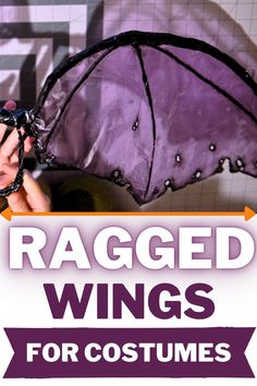 a person holding an umbrella with the words ragged wings for costumes