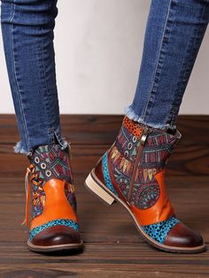 Make an artistic style statement in this durable leather ankle boot embellished with tassel detailed accent at the ankle and a vibrant mix of patterns and colors. 0.78'' heel 3.5" shaft 10.6"  circumference Leather & Canvas upper Cotton floral fabric lining Leather mid-sole Rubber sole Retro Multicolor Boots For Fall, Multicolor Retro Boots For Fall, Multicolor Ankle-high Boots For Fall, Bohemian Multicolor Boots For Spring, Multicolor Bohemian Boots For Spring, Bohemian Ankle-high Boots For Fall, Multicolor Bohemian Boots For Festivals, Bohemian Multicolor Boots For Festivals, Short Heeled Boots