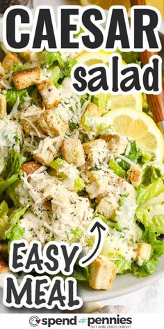 a close up of a salad on a plate with lemons and parmesan cheese