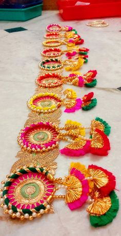 colorfully decorated garlands are laid out on the floor