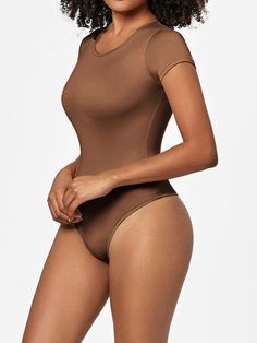 Features: Basic style Sheer: Opaque Stretch: Slightly stretchy Material composition: 79.3% polyester, 20.7% spandex Care instructions: Machine wash cold. Tumble dry low. Imported Size US Top Length Bust Waist Hip Shoulder Sleeve Length S 2/4 26.2 26.8 22 25.2 12.6 4.9 M 6 26.8 28.3 23.6 26.8 13.4 5.3 L 8 27.4 29.9 25.2 28.3 14.2 5.7 XL 10 28 31.5 26.8 29.9 15 6.1 2XL 12 28.5 33.1 28.3 31.5 15.7 6.5 3XL 14 29.1 34.6 29.9 33.1 16.5 6.9 Basic Solid Color Elastane Bodysuit, Stretch Nylon Bodysuit In Solid Color, Solid Color Stretch Nylon Bodysuit, Stretch Nylon Solid Color Bodysuit, Solid Nylon Stretch Bodysuit, Stretch Nylon Bodysuit, Fitted Short Sleeve Solid Bodysuit With Lined Body, Fitted Solid Short Sleeve Bodysuit With Lined Body, Solid High Stretch Short Sleeve Seamless Bodysuit