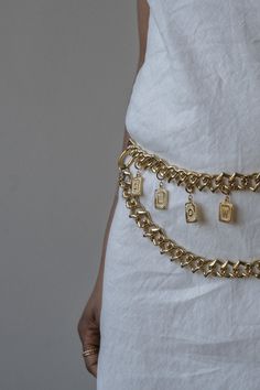 White spring dress styled with gold custom monogram chain belt Adjustable Waist Chain As A Gift, Metal Jewelry With Adjustable Chain Nameplate, Gold Chain Link Belt As Gift, Gold Chain Link Belt - Ideal Gift, Metal Jewelry With Initial Pendant Chain, Metal Chain Jewelry With Initial Pendant, Industrial Piping, White Dress Spring, Spring Fashion Dresses