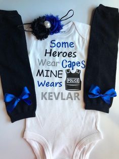 "*CURRENT PROCESSING TIME: 3-6 business days before shipment* my dad is a cop, my mom is a cop, father's day police outfit, baby father's day shirt, my dad is my hero Choose from 1 or all 3 pieces: 1. Long or short sleeved \"Some heroes wear capes. Mine wears Kevlar \" bodysuit/short. ATTN: Sixes 24 months and under will be on a bodysuit and sizes 3T and up will be made on a shirt. 2. Black legwarmers with blue bow--sizes 3 months and under will receive SMALL legwarmers and sizes 6 months + will Police Baby, Police Outfit, Baby Jeans, Baby Girl Outfit, Body Suit With Shorts, Everything Baby, Fathers Day Shirts, Girls Clothing Sets, Baby Outfits