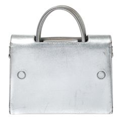 DIOR Metallic Silver Leather Medium ever BagEvery stitch and detail on this Diorever bag gives high praise to quality craftsmanship and validates the painstaking effort that goes into making a handbag art as fine as this. Structured to perfection using the finest leather and designed with a crest shaped clasp that truly says DIOR this bag is a beauty. A reversible flap secures the leather insides and two top handles are provided for you to hold the bag. They say the Diorever is the tote version of the Diorama and although the resemblance can be seen we would like to believe the Diorever has a unique touch only a handbag lover like you can appreciate. Size: Height: 22 cm Width: 14 cm Length: 30 cmMaterial: Leather Diorever Bag, Casual Backpack, Metallic Leather, Luxury Women, Womens Backpack, Brunei, Bottega Veneta, Bag Sale, Luxury Bags