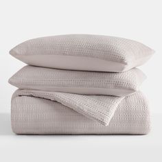 three pillows stacked on top of each other