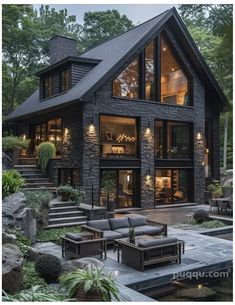 a large black house with lots of windows