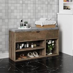 a bathroom with a marble counter top and shelves