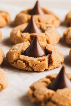 peanut butter blossoms with chocolate on top and the words flourless, peanut butter blossoms