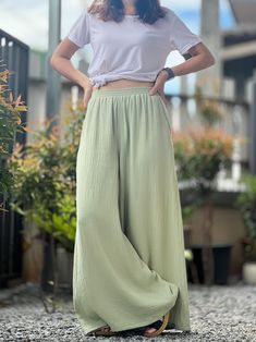 With a subtle texture unique to double gauze fabric, these pants exude a casual yet sophisticated look that can be dressed up or down. Side pockets add a functional touch, keeping essentials close at hand. Whether you're running errands, enjoying a day out, or unwinding after a long day, these muslin pants are your go-to choice for a blend of luxury and practicality. Pair them with a simple tee or a flowy blouse to complete your chic, laid-back ensemble. Size XS Waist 26 Hip 36" Long 38" Size S Waist 28 Hip 38" Long 38" Size M Waist 30 Hip 40" Long 38" Size L Waist 32" Hip 42" Long 38" Size XL Waist 34" Hip 44" Long 38" Size XXL Waist 36" Hip 46" Long 38" Size XXXL Waist 38" Hip 48" Long 38" Model is 5′2″ (158cm) tall with a 81cm/32″ bust, 69cm/27″ waist, 92cm/36″ hips Important Notice Reg Muslin Pants Women, Solid Bohemian Ankle-length Pants, Flowy Wide-leg Harem Pants, Bohemian Wide-leg Pants In Solid Color, Double Gauze Pants, Beige Cotton Wide-leg Harem Pants, Muslin Pants, Beige Elastic Waistband Wide-leg Harem Pants, Gauze Pants