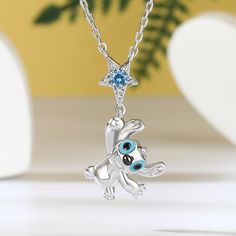 This "Picking stars" little monster birthstone necklace is a charming testament to a unique love bond. Its design captures the essence of the playful yet lovable creature, embodying the playful spirit that exists in every relationship. It is a symbol of love and a reminder of the joy and happiness that love brings. Wear it close to your heart and let it serve as a constant reminder of the love that shines in your life.Carat Weight: 0.5 ctStone Size: 3 mmStone Type: Jeulia® StoneNumber of Stones: 1 Stone Color: Aquamarine BlueStone Shape: RoundCarat Weight: 0.057 ctStone Size: 1,0.8 mmStone Type: Jeulia® StoneNumber of Stones: 8 Stone Color: Diamond White, Fancy BlackStone Shape: RoundWeight: 2.3 gWidth: 14 mmHeight: 24.6 mmThickness: 6.6 mmMaterial: 925 SilverPlating Color: Silver, BlackLe Whimsical Star-shaped Jewelry With Star Charm, Whimsical Star Charm Jewelry As Gift, Whimsical Star Charm Jewelry Gift, Playful Silver Necklace For Birthday, Sterling Silver Star Birthstone Necklace, Playful Star Charm Jewelry For Gifts, Sterling Silver Star-shaped Necklace With Birthstone, Playful Jewelry With Star Charm For Gift, Cute Star Charm Jewelry Gift