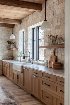 a kitchen with wooden cabinets and white counter tops next to a large window that looks out onto the outdoors