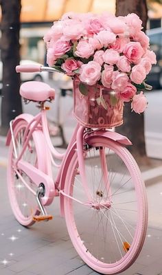 a pink bicycle with flowers in the basket