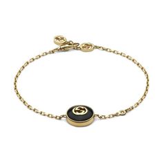 From Gucci, the Interlocking G logo appears in elegant new interpretations for Pre-Fall 2024. Precious black onyx stone is paired with yellow 18k gold and embellished with a sparkling diamond. This chain bracelet can be matched with other accessories from the same line. 18k yellow gold and black onyx stone Chain with Interlocking G detail Interlocking G charm 0.5" 1 white diamond, approximately 0.008 carats Clasp closure with Interlocking G Gucci Style #: YBA786556001017 Luxury Modern Gucci Bracelets, Luxury Gold-tone Jewelry With Logo Charm, Luxury Gold-tone Bracelet With Logo Charm, Formal Yellow Gold Bracelets With Gold-tone Logo, Designer Yellow Gold Jewelry With Gold-tone Hardware, Gold-tone Jewelry With Logo Charm For Formal Occasions, Modern Jewelry With Gold-tone Logo Plaque As Gift, Designer Jewelry Bracelet With Logo Charm, Modern Gift Jewelry With Gold-tone Logo Plaque