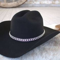 Silver and Rhinestone Bling Hat Band for cowgirls. Dress up your cowboy hat with this gorgeous hat jewelry!This rhinestone strand hatband comes with 3 layers of clear rhinestones set on silver metal. It is adjustable with a metal clasp in the back. Fits up to size 7 1/2 hat. * Hat not included. Silver Rhinestone Hat For Rodeo, Silver Hat With Rhinestones For Rodeo, Western Silver Hat With Rhinestones, Western Style Adjustable Hat With Rhinestone Fringe, Adjustable Silver Hat Bands For Festivals, Adjustable Western Jewelry For Party, Adjustable Western Style Party Jewelry, Adjustable Western Style Jewelry For Parties, Adjustable Rhinestone Hat Bands For Western-themed Events