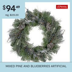 a christmas wreath with pine cones and blueberries is on sale for $ 94 99