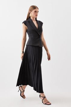 This Expertly-Crafted Garment Combines The Fluidity Of Soft Pleats With The Directional Aesthetic Of A Tailored Blazer. Notched Lapels Provide A Directional Touch, While Soft Pleats Cascade Down To Just Below The Knee.Linen Fabricationcompact Stretchpleated Skirtmidi Hemline Tailored Black V-neck Dress, Fitted Pleated Skirted Dresses, Fitted Cocktail Dress With Skirted Shape, Fitted Formal Skirted Dress, Fitted Sleeveless Midi Dress With Pleated Skirt, Black Pleated Skirt Dress For Workwear, Elegant Skirted Cocktail Dress, Elegant Cocktail Dress With Skirt, Formal Pleated Skirted Dress