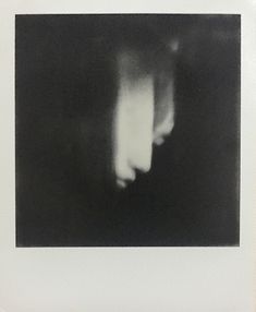 an image of a blurry black and white photo with light coming from the top