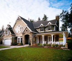 a large house with lots of windows and green grass