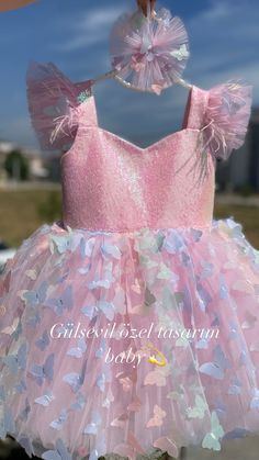 custom handmade dresses for your baby. Made with tulle. It is prepared with a soft cotton lining. It has a zipper on the back, very easy and comfortable to wear. 👉🏻 you can leave a message for more questions 👉🏻 It is a handmade dress that you can measure and customize. Very dense tulle layers are used, very fluffy, personalized color options are available, you can personalize ✈️Delivered to many countries within 1-5 days by express shipping 💝 Pink Fairy Dress With Ruffles, Pink Sleeveless Dress With Butterfly Print, Party Dress With Ruffles And Butterfly Shape, Handmade Fitted Pink Dress, Cute Pink Princess Dress For Baptism, Butterfly Shape Tulle Dress For Party, Butterfly-shaped Tulle Dress For Party, Pink Party Dresses With Butterfly Embroidery, Butterfly Shape Tulle Party Dress