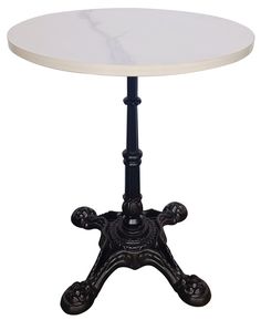 a white marble top table with black metal base