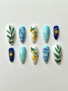 Light Blue Nails With Sunflower, Mexico Inspired Nails Art Designs, Europe Inspired Nails, Gel X Nail Inspo Almond, Nails With Sun Design, Mismatched Nails Summer, Outdoorsy Nails, Travel Nails Designs, Sardine Nails