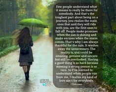 a woman walking down a dirt road with an umbrella in her hand and a poem written on it