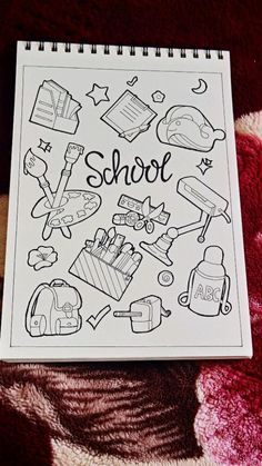 a notebook with the words school written on it and pictures of things to color in