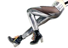 All power to the thunder thigh!  These metallic leggings feature a cutout lightning bolt at the left side, with inset black mesh.  Wear them and feel your might! Also available in other colors!  See all options here: https://www.etsy.com/shop/ShopMichelleRose?&search_query=lightning+leggings UNISEX SIZE GUIDE If your waist is... ...order: 24"-25" - XXS 26"-27" - XS 28"-29" - S 30"-31" - M 32"-33" - L 34"-35" - XL 36"-38" - XXL 39"-42" - XXXL If you find yourself between sizes, I recommend ordering the smaller of the two for the snuggest disco-style fit. Made in Los Angeles. Nylon/Spandex. Wash cold, gentle cycle. Hang to dry. Lightning Leggings, Disco Style, Wet Look Leggings, Metallic Leggings, Metallic Fabric, Wet Look, Lightning Bolt, Foil Print, Black Mesh