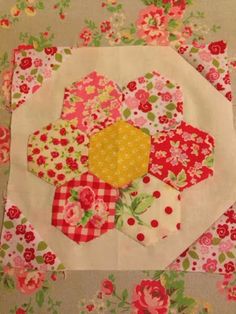 a patchwork quilt with flowers on it