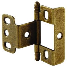 an antique brass plated door hinge with two square holes on the front side