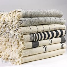 a stack of rugs stacked on top of each other