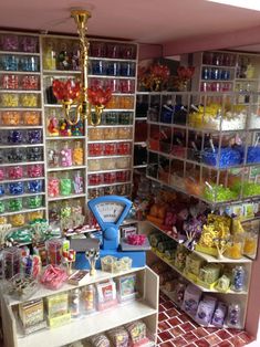 a room filled with lots of different types of candy and candies on shelving units