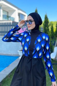 The patterned part of the tunic is made of lycra fabric.   The bottom black part of the tunic is The post Dreamlight Burkini appeared first on Burkini Remsa. Long Sleeve Swim Dress For Poolside, Elegant Long Sleeve Swimwear For The Beach, Fitted Swim Dress With Uv Protection For Pool, Stretch Long Sleeve Swim Dress For Pool, Stretch Swimwear With Uv Protection For Diving, Blue Fitted Swim Dress With Upf 50+, Stretch Uv Protection Swimwear For Diving, Uv Protection Stretch Swimwear For Diving, Elegant Long Sleeve Stretch Swimwear