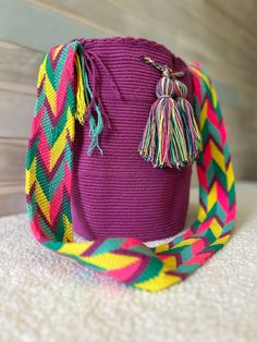 Crafted with utmost care and attention, this crochet bags better known as Wayuu bags, are a true gem, they embody the labor of a dedicated artisan for a span of around 10-15 days. The intricate creation process and dedication invested in its making shine through its every detail. Tailored for the woman who recognizes and treasures genuine artistry, this bag not only offers ample space and ease of cleaning but also serves as a wearable masterpiece. Made in Colombia Handmade Body color: Unicolor S Violet Crochet, Crochet Bucket Bag, Blackberry Smoothie, Retro Crochet, Crochet Drawstring, Perfect Beach Bag, Purse Crochet, Crochet Shoulder Bags, Drawstring Purse