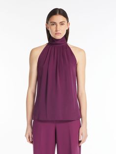 Find MAX MARA American Silk Top on Editorialist. Sleeveless top with halter neck, made of exquisite pure silk charmeuse. Unlined garment with a flowing line, featuring a soft pleated pattern on the front, high collar and small rounded side slits. Teardrop closure at the back with covered buttons at the rear of the collar. Elegant Silk Halter Top For Formal Occasions, Elegant Silk Halter Top For Formal Events, Elegant Satin Halter Neck Top, Sleeveless Satin Halter Top For Formal Occasions, Silk Halter Top For Evening, Satin Sleeveless Halter Top For Formal Events, Elegant Silk Halter Top For Summer, Silk Halter Top For Evening Wear, Elegant Fitted Silk Halter Top