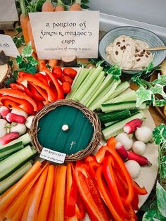 an assortment of veggies on a table with a sign in the middle that says, a portion of savored macaroni's crop