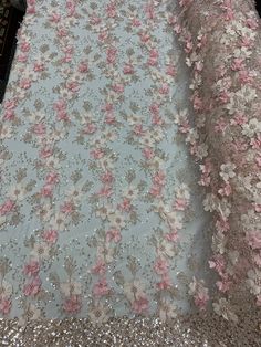 two dresses with pink flowers on them and sequins around the edges, all in different colors