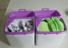 two purple and white containers filled with food on top of a table next to each other