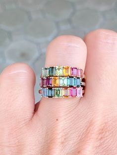 Add a splash of color and playful style to your everyday look with this 14K gold Rainbow Tourmaline Stacking Band. Perfect for layering, this unique and eye-catching band adds a vibrant touch to any outfit! Dare to make a fashion statement and become the envy of all your friends! ♥ The overall setting measures 17.8 mm in width, 4.3 mm in length, and sits 3.3 mm tall, band width is 1.7 mm ♥ We have 3 rings in stock. What you see is what you will receive! ♥ Ring Size: US 7 (Free resizing up or down one size) ♥ Material: 14K Gold ♥ Gemstone: Tourmaline, between 1.3-1.5ct total for each ring ♥ Free shipping in the US.  ♥ This is in stock and ready to ship right away! ▶▶ Sign up for our newsletter to receive a 10% off coupon for purchases from our website: https://www.auroradesigner.com/pages/n Wedding Bouquet Photo Charm, Rainbow Tourmaline, Rings Pink, Gemstone Wedding, Yellow Gifts, Playful Style, Stacking Bands, Photo Charms, Montana Sapphire