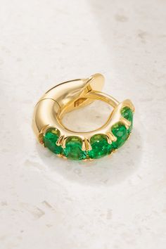 Spinelli Kilcollin creates jewelry that's "made to be enjoyed", so you can expect to wear the brand's pieces for countless occasions, and years to come. Handcrafted in the label's LA studio, this 'Mini Macro' earring is cast from 18-karat gold and set with a row of vibrant emeralds. Elegant Green Huggie Jewelry, Fine Jewelry Emerald Huggie Earrings, Luxury Round Hoop Earrings With Gemstones, Luxury Round Gemstone Hoop Earrings, Yellow Gold Emerald Huggie Jewelry, Elegant Green Huggie Earrings, Yellow Gold Tsavorite Earrings Fine Jewelry, Yellow Gold Emerald Hoop Earrings Fine Jewelry, Elegant Green 14k Gold Huggie Earrings