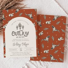 an orange and white baby shower with cactus print on the front, and a red envelope that says oujaw on the back