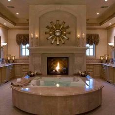 a large bathroom with a fireplace and jacuzzi tub