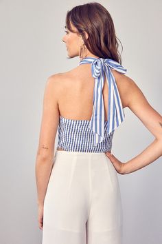 CROSS NECK BACK TIE CROP TOP Size + Fit - Model is wearing size S - Measurements taken from size S - 5'9" / 175CM - 32-24-34 WOOVEN TOP FabricSELF: 50% COTTON 50% POLYESTER, LINING: 100% POLYESTER Striped Halter Neck Top For Spring, Striped Halter Neck Top For Summer, Fitted Striped Tops For The Beach, Casual Fitted Tops With Tie Back, Blue Stretch Tops With Tie Back, Blue Stretch Tie-back Top, Fitted Cotton Tops With Tie Back, Fitted Cotton Tie-back Top, Fitted Cotton Tie Back Top