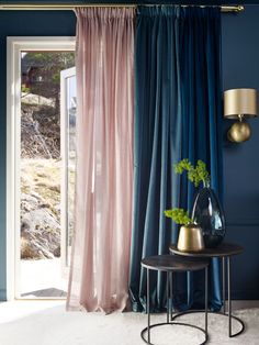 the curtains in this room are blue and pink