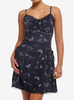 Looking for a moody mini dress to fit the moodiness of the winter season? This Daisy Street style is black velvet with lace trim  black lace-up detail on the sides and an allover print of butterflies and cherubs. It also has adjustable straps.95% polyester; 5% spandexWash cold; dry lowLength: 35"ImportedListed in junior sizesModel is 5'9"Model wears size Small Black Fairy Grunge Mini Dress For Spring, Fairy Grunge Black Mini Dress For Spring, Black Butterfly Print Spring Dresses, Black Butterfly Print Dress For Spring, Black Butterfly Print Dresses For Spring, Black Sleeveless Dress With Butterfly Print, Sleeveless Black Dress With Butterfly Print, Black Velvet Gothic Mini Dress, Cutesy Outfit